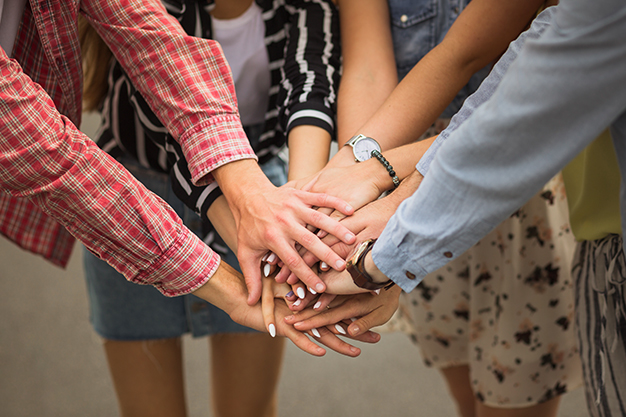 Students joining hands for success